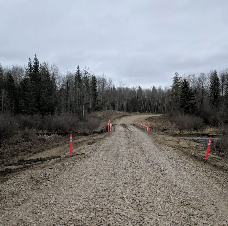 Washout leads to temporary bridge on Wolf Lake Road